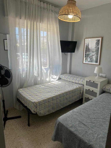 Apartamento Laguna de El Portil, alquiler temporada, piscina, pista de pádel, terraza acristalada, plaza de garaje

