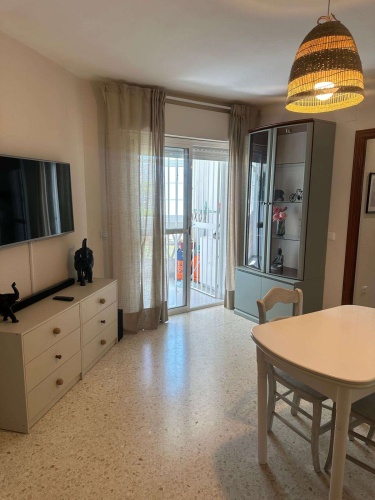 Apartamento Laguna de El Portil, alquiler temporada, piscina, pista de pádel, terraza acristalada, plaza de garaje

