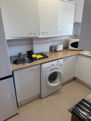 Apartamento Laguna de El Portil, alquiler temporada, piscina, pista de pádel, terraza acristalada, plaza de garaje

